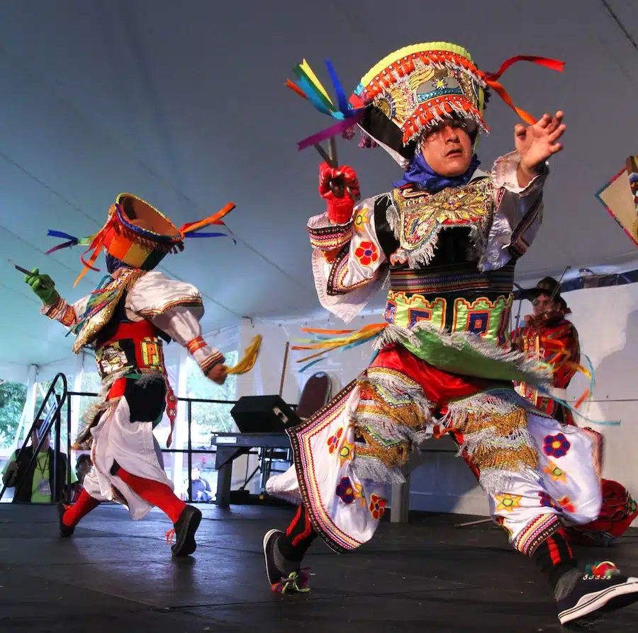 Dancers performing in colorful traditional costumes